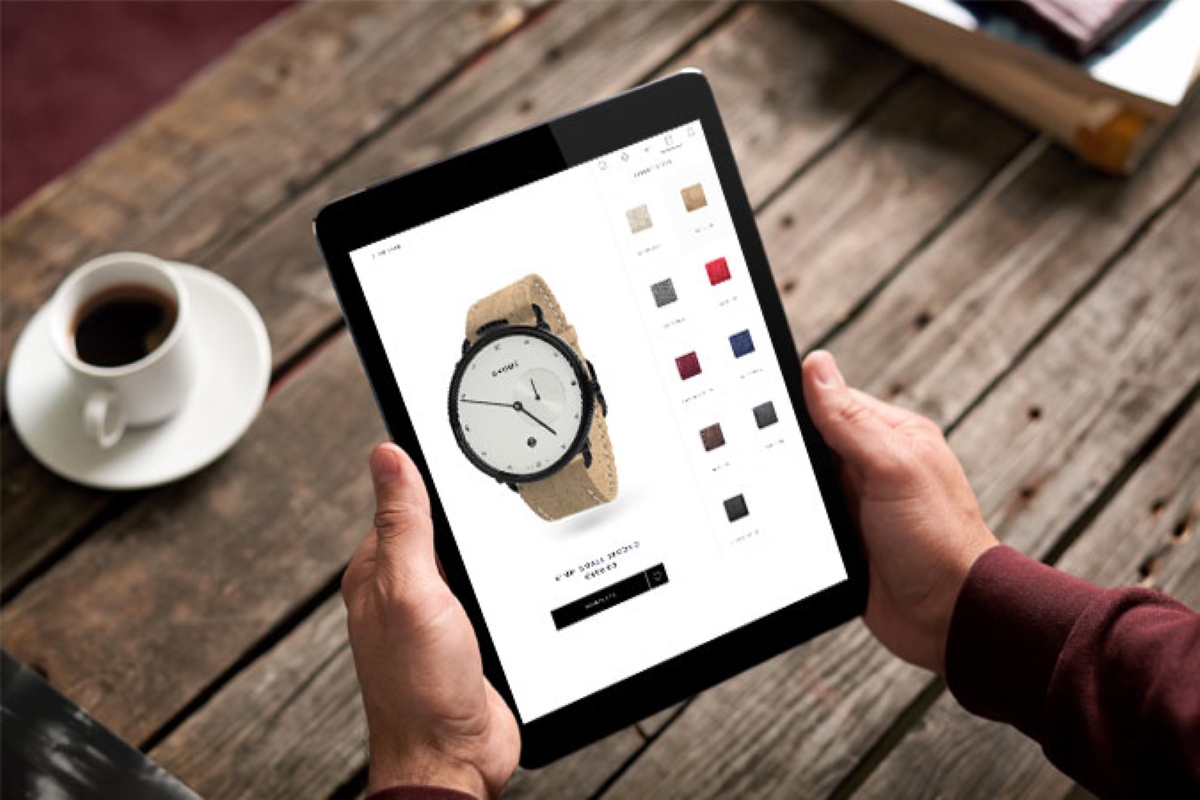 product configurator 4 Man holding a tablet with a watch customization page on the screen